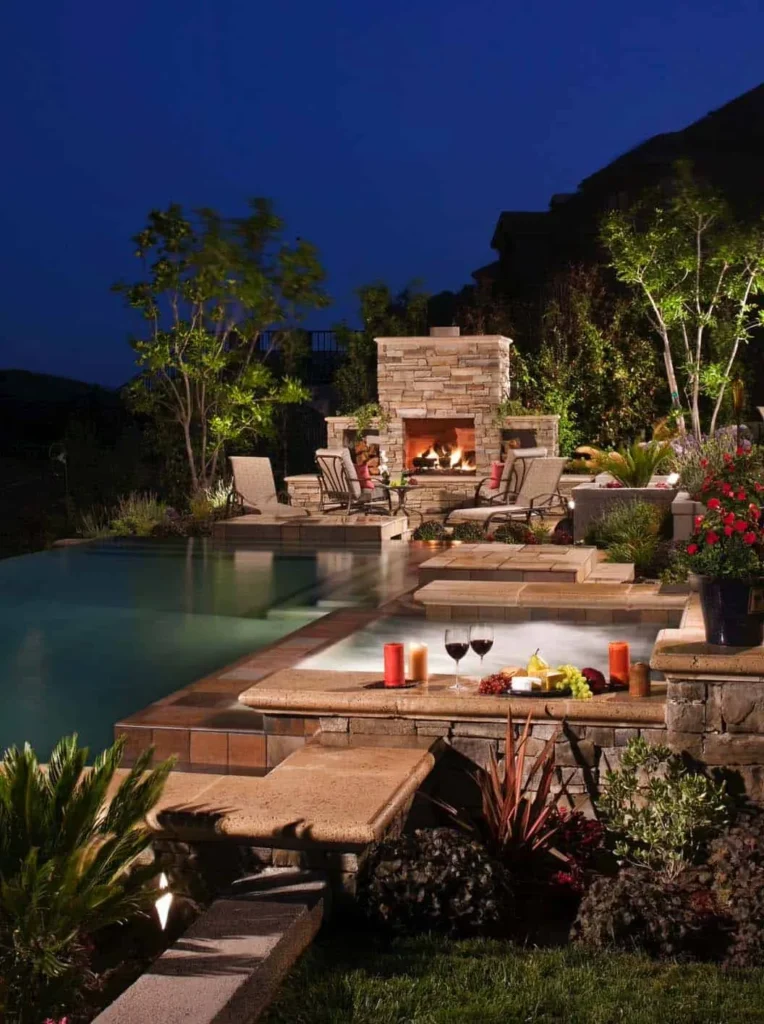 Custom luxury pool with swim-up bar, perimeter-overflow spa, and sophisticated water features