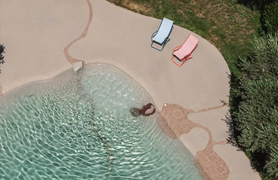 Naturi lagoon pool with fully sloped sand shoreline across three design tiers